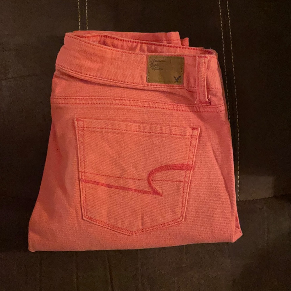 Coral colored skinny jeans American Eagle
